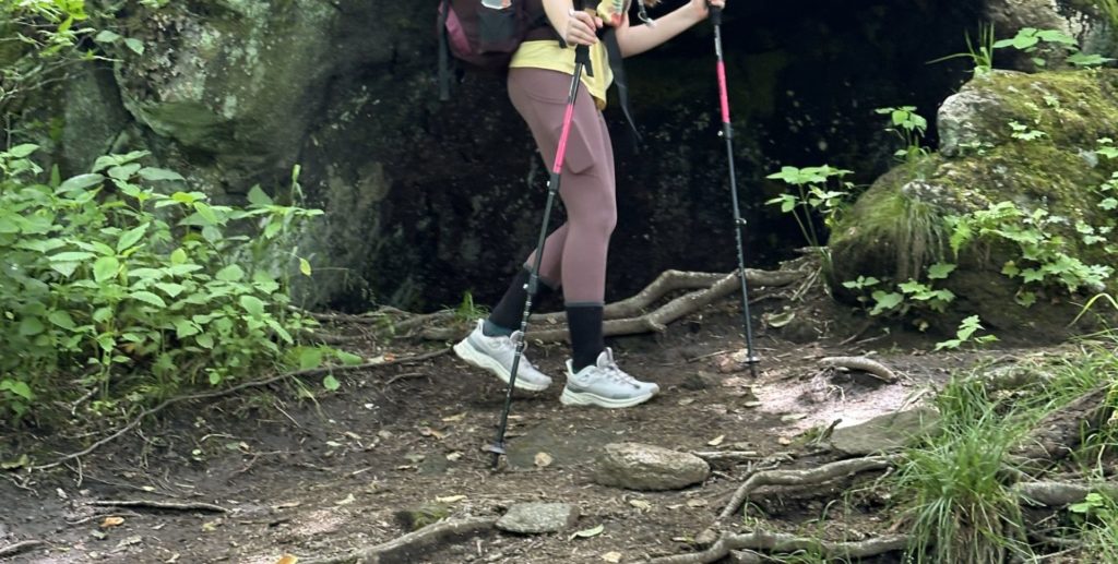 Young hiker finding her way along the path on an Eremos Backpacking Experience.